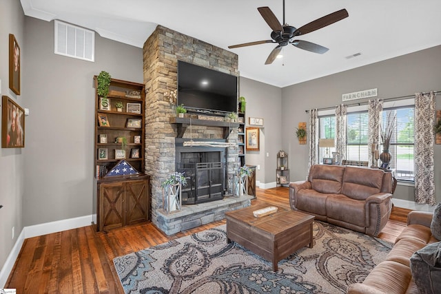 515 Herman Brooks Rd, Belton, SC 29627 - living room featuring wood finished floors, a stone fireplace, crown molding, and a ceiling fan