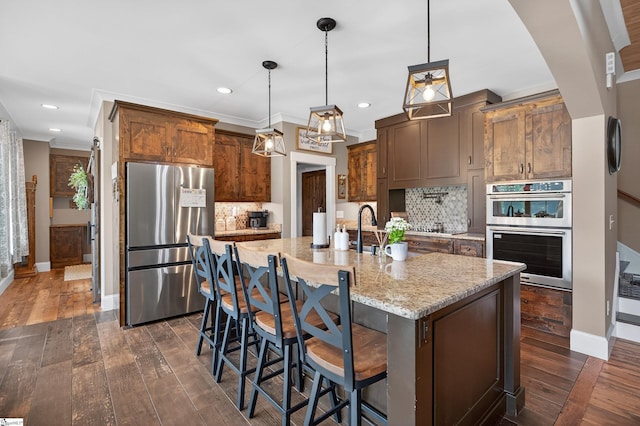 515 Herman Brooks Rd, Belton, SC 29627 - kitchen featuring stainless steel appliances, tasteful backsplash, light stone counters, dark wood-style flooring, and recessed lighting