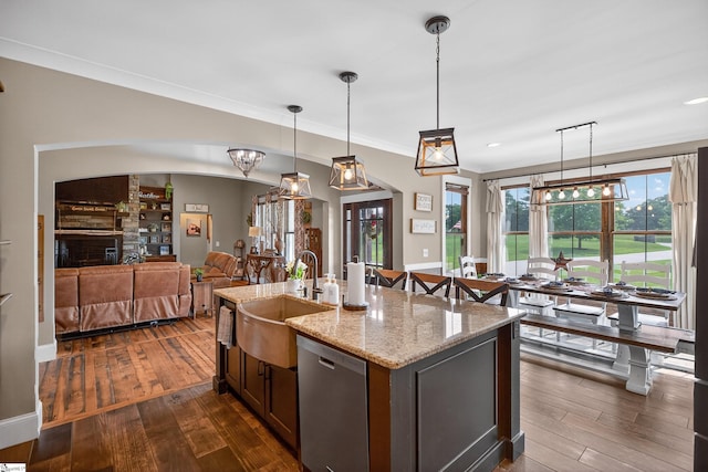 515 Herman Brooks Rd, Belton, SC 29627 - kitchen with stainless steel dishwasher, dark wood-type flooring, open floor plan, pendant lighting, and light stone counters