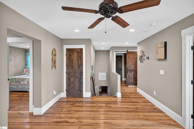 515 Herman Brooks Rd, Belton, SC 29627 - entryway featuring light wood finished floors, a barn door, a ceiling fan, and recessed lighting