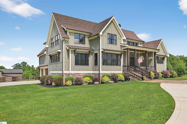 515 Herman Brooks Rd, Belton, SC 29627 - view of front of property with a shingled roof, concrete driveway, board and batten siding, a standing seam roof, and a front yard