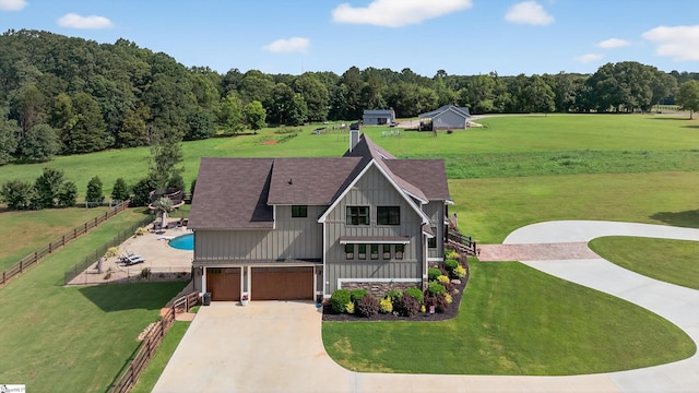 515 Herman Brooks Rd, Belton, SC 29627 - view of front of home with concrete driveway, board and batten siding, an attached garage, and roof with shingles