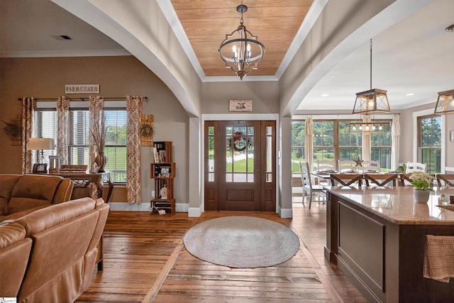 515 Herman Brooks Rd, Belton, SC 29627 - foyer entrance featuring a chandelier, hardwood / wood-style flooring, ornamental molding, and arched walkways