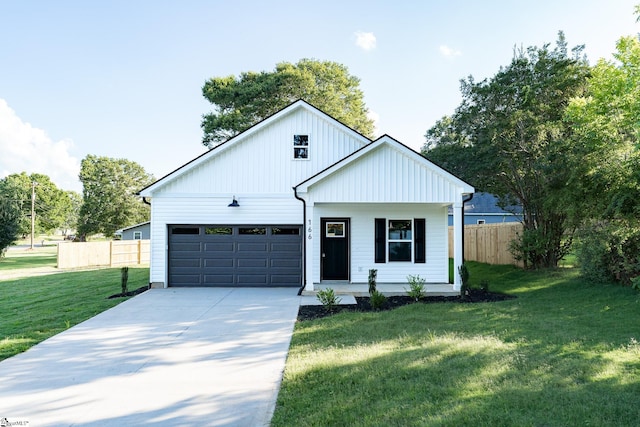166 Dunbar St, Wellford, SC 29385 - view of front of house with driveway, a porch, an attached garage, and board and batten siding