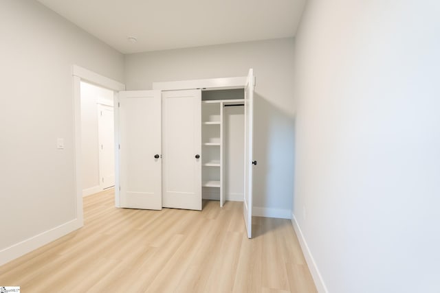 166 Dunbar St, Wellford, SC 29385 - unfurnished bedroom with light wood-type flooring and a closet