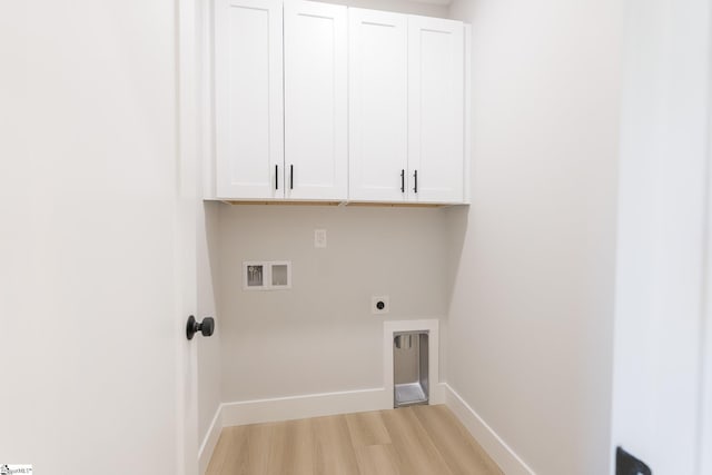 166 Dunbar St, Wellford, SC 29385 - laundry room featuring light wood-style floors, cabinet space, hookup for an electric dryer, and hookup for a washing machine