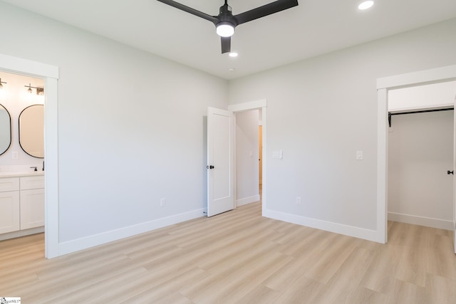 166 Dunbar St, Wellford, SC 29385 - unfurnished bedroom featuring light wood-style floors, a walk in closet, recessed lighting, a closet, and ensuite bath