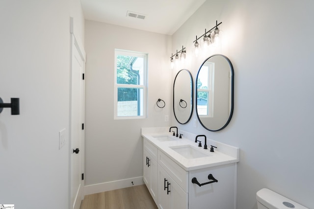 166 Dunbar St, Wellford, SC 29385 - bathroom with double vanity and wood finished floors