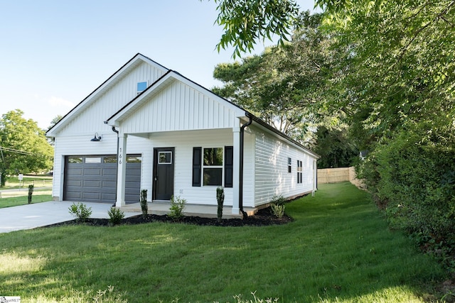 166 Dunbar St, Wellford, SC 29385 - view of front of home featuring board and batten siding, concrete driveway, and a garage