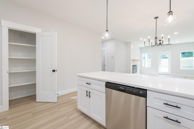 166 Dunbar St, Wellford, SC 29385 - kitchen featuring stainless steel dishwasher, a chandelier, white cabinets, light wood-style flooring, and hanging light fixtures