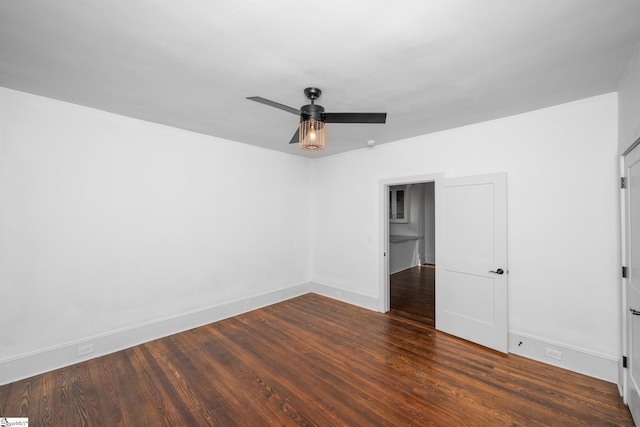 521 Anderson St, Greenville, SC 29601 - unfurnished bedroom with dark wood-style floors and ceiling fan