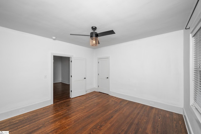 521 Anderson St, Greenville, SC 29601 - unfurnished bedroom featuring dark wood-type flooring and ceiling fan