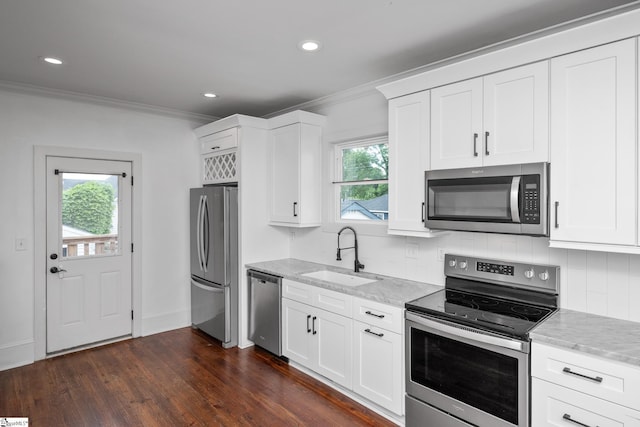 521 Anderson St, Greenville, SC 29601 - kitchen with stainless steel appliances, crown molding, backsplash, light stone countertops, and healthy amount of natural light
