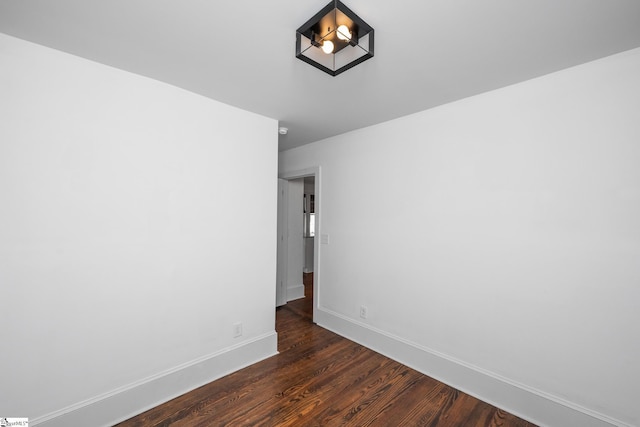 521 Anderson St, Greenville, SC 29601 - empty room featuring dark wood-type flooring and baseboards