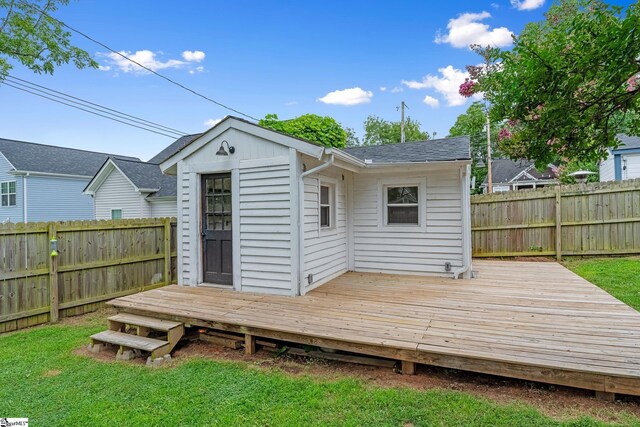 521 Anderson St, Greenville, SC 29601 - back of property with a fenced backyard, a wooden deck, and a shingled roof