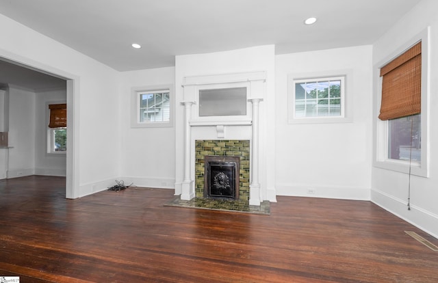 521 Anderson St, Greenville, SC 29601 - unfurnished living room with wood finished floors, healthy amount of natural light, a fireplace with flush hearth, and recessed lighting