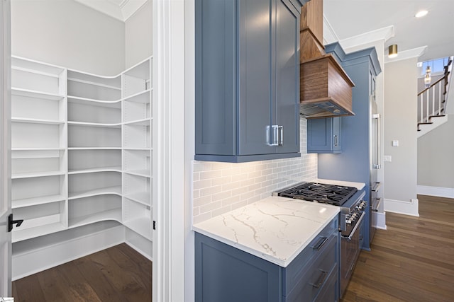 404 Odell St, Greenville, SC 29615 - kitchen featuring stainless steel range, blue cabinets, dark wood-type flooring, backsplash, and crown molding