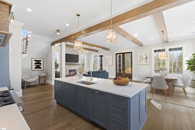 404 Odell St, Greenville, SC 29615 - kitchen with a chandelier, open floor plan, a lit fireplace, wood finished floors, and recessed lighting