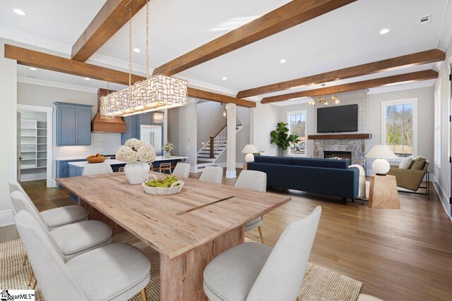 404 Odell St, Greenville, SC 29615 - dining room with stairs, dark wood-style flooring, beam ceiling, recessed lighting, and a fireplace