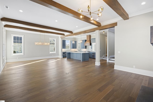 404 Odell St, Greenville, SC 29615 - unfurnished living room featuring a chandelier, beamed ceiling, dark wood finished floors, and recessed lighting