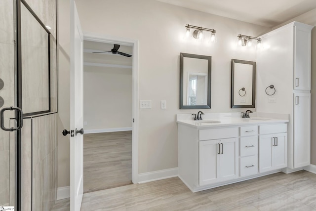140 Mimosa Rd Lot 27, Inman, SC 29349 - full bathroom featuring double vanity, a shower stall, ceiling fan, and wood finished floors