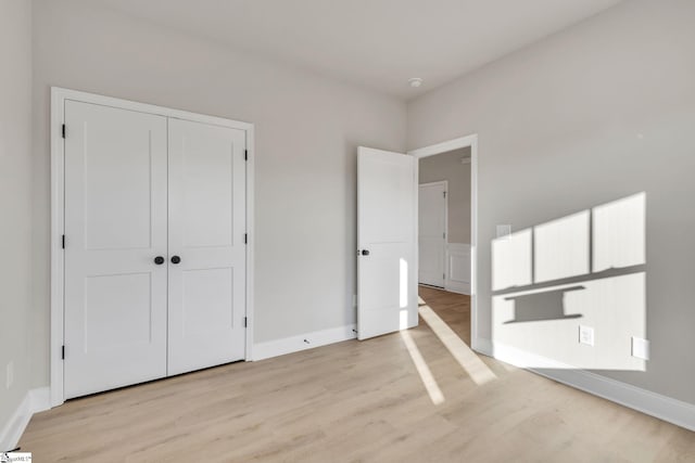 140 Mimosa Rd Lot 27, Inman, SC 29349 - unfurnished bedroom featuring light wood finished floors and a closet