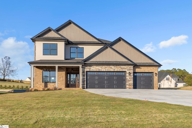 140 Mimosa Rd Lot 27, Inman, SC 29349 - craftsman-style house with driveway, a front lawn, a garage, brick siding, and board and batten siding
