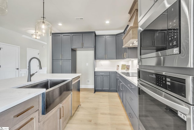 140 Mimosa Rd Lot 27, Inman, SC 29349 - kitchen with stainless steel appliances, light stone counters, light wood-style floors, recessed lighting, and pendant lighting