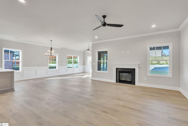 140 Mimosa Rd Lot 27, Inman, SC 29349 - unfurnished living room with ornamental molding, a glass covered fireplace, a ceiling fan, a chandelier, and light wood-type flooring