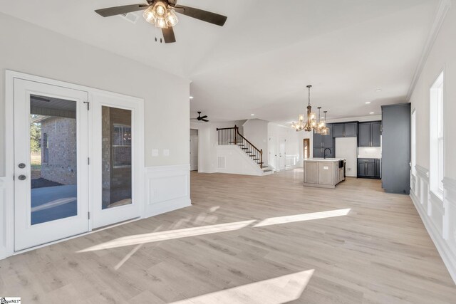 140 Mimosa Rd Lot 27, Inman, SC 29349 - unfurnished living room featuring a ceiling fan, a decorative wall, stairway, a chandelier, and light wood-style floors