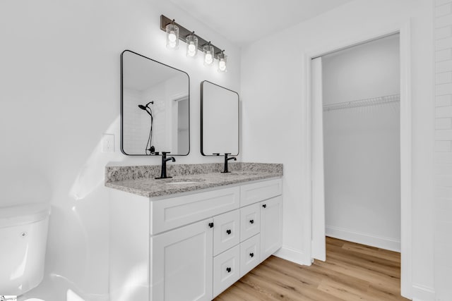2 Melbourne Ln, Greenville, SC 29615 - bathroom with double vanity, wood finished floors, and a spacious closet