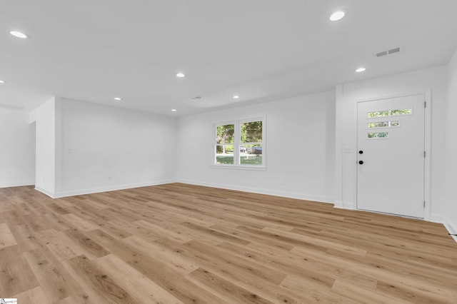 2 Melbourne Ln, Greenville, SC 29615 - unfurnished living room featuring light wood-type flooring and recessed lighting