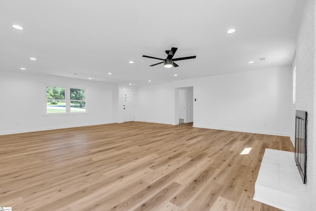 2 Melbourne Ln, Greenville, SC 29615 - unfurnished living room featuring recessed lighting, light wood finished floors, a fireplace, and a ceiling fan