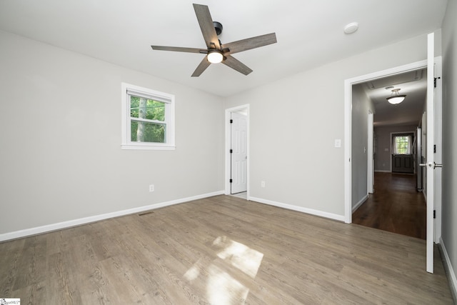 101 Havendale Dr, Fountain Inn, SC 29644 - spare room with plenty of natural light, ceiling fan, wood finished floors, and a smoke detector