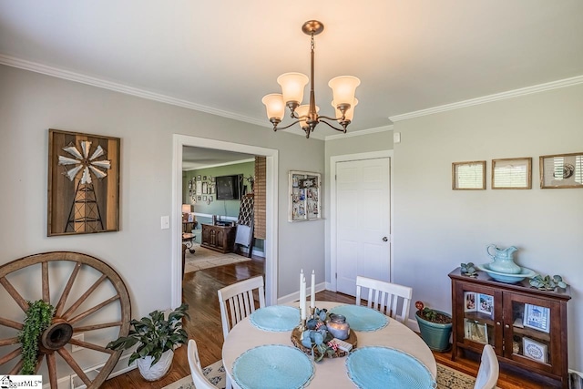 849 Harvey Rd, Greer, SC 29651 - dining space featuring crown molding, wood finished floors, and a chandelier