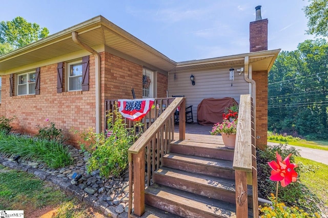 849 Harvey Rd, Greer, SC 29651 - doorway to property with a wooden deck, brick siding, and a chimney