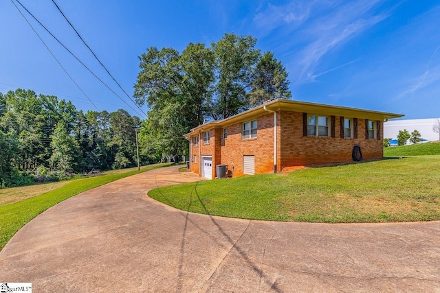 849 Harvey Rd, Greer, SC 29651 - view of home's exterior with driveway, brick siding, a lawn, and an attached garage