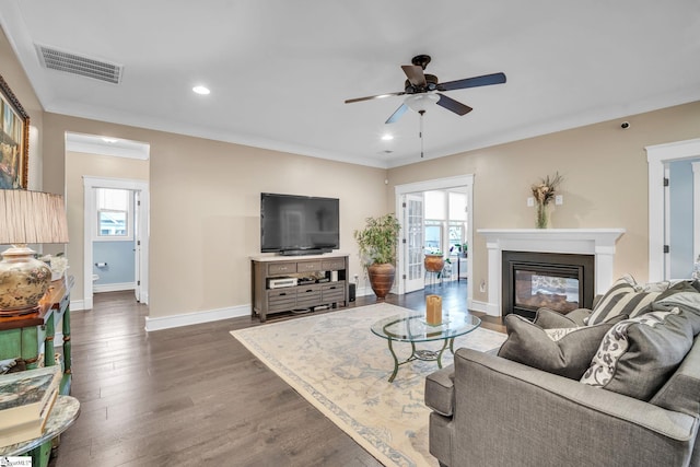 101 Mares Head Pl, Taylors, SC 29687 - living area with ceiling fan, wood finished floors, recessed lighting, a glass covered fireplace, and crown molding