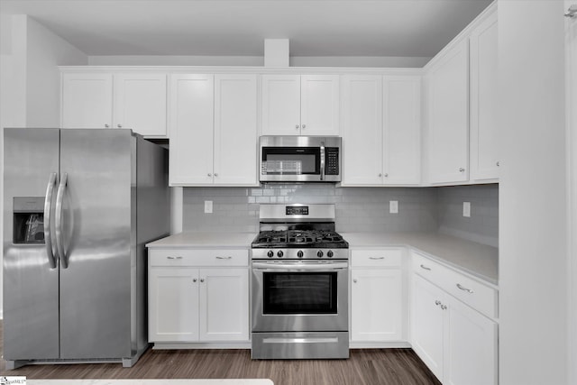 313 E Compass Way, Easley, SC 29640 - kitchen featuring stainless steel appliances, light countertops, wood finished floors, white cabinetry, and tasteful backsplash