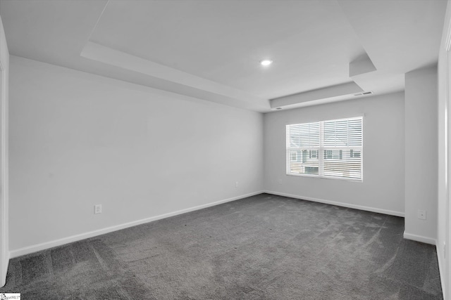 313 E Compass Way, Easley, SC 29640 - empty room featuring a raised ceiling, dark carpet, and recessed lighting
