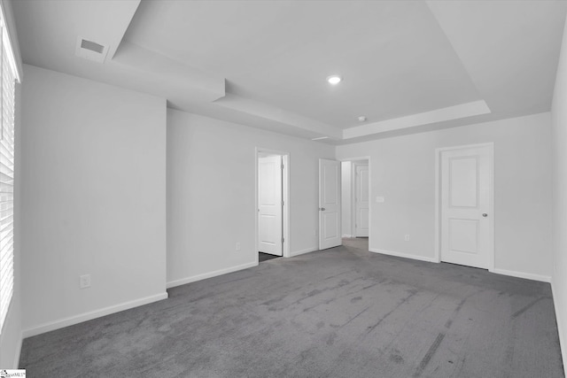 313 E Compass Way, Easley, SC 29640 - carpeted empty room with a tray ceiling and baseboards