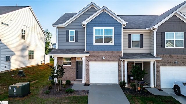 313 E Compass Way, Easley, SC 29640 - view of front of property with brick siding, concrete driveway, an attached garage, and roof with shingles