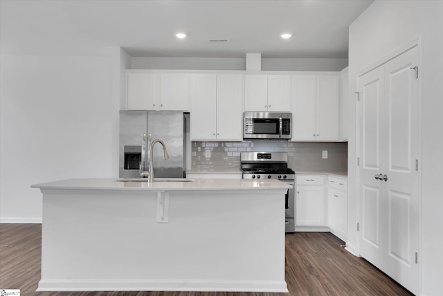 313 E Compass Way, Easley, SC 29640 - kitchen featuring stainless steel appliances, decorative backsplash, light countertops, white cabinets, and recessed lighting