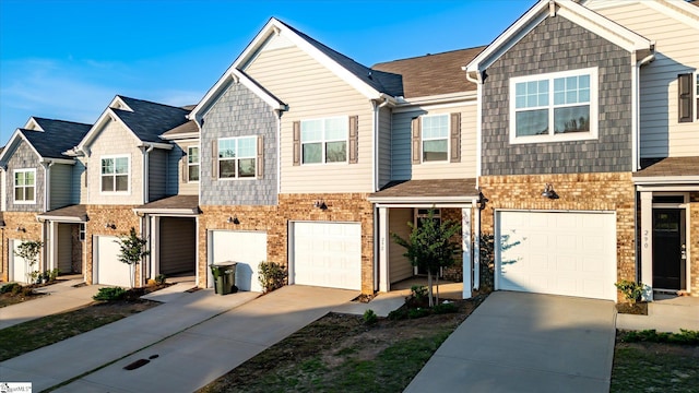 292 E Compass Way, Easley, SC 29640 - townhome / multi-family property featuring concrete driveway, an attached garage, and brick siding