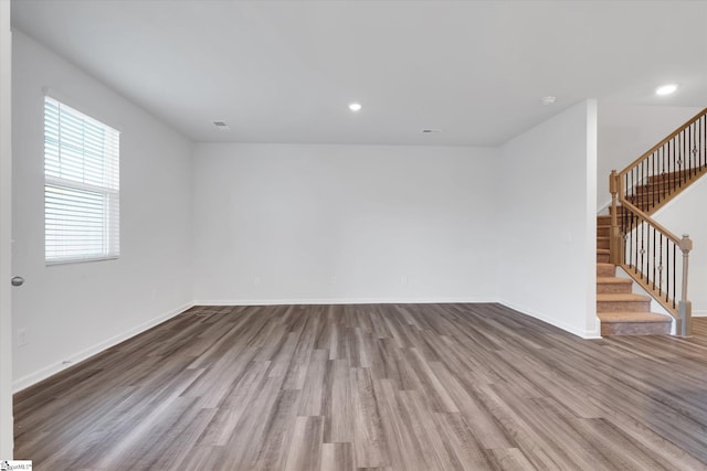 292 E Compass Way, Easley, SC 29640 - empty room with wood finished floors, stairway, and recessed lighting