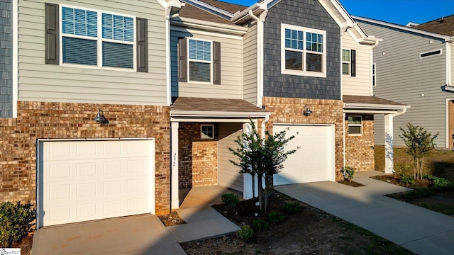 292 E Compass Way, Easley, SC 29640 - view of front of house with a garage, brick siding, and concrete driveway