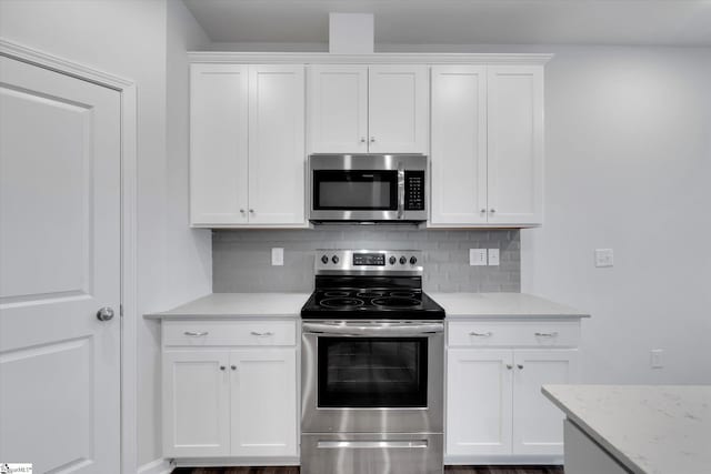 292 E Compass Way, Easley, SC 29640 - kitchen featuring stainless steel appliances, white cabinets, and backsplash