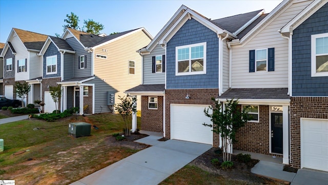 291 E Compass Way, Easley, SC 29640 - view of property featuring brick siding, a garage, and concrete driveway