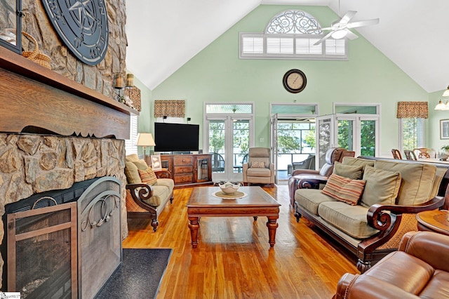 224 Seabright Cir, Cross Hill, SC 29332 - living area featuring high vaulted ceiling, wood finished floors, a ceiling fan, a fireplace, and french doors