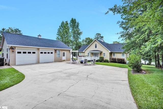 224 Seabright Cir, Cross Hill, SC 29332 - view of front of property featuring a front yard, a garage, concrete driveway, and a shingled roof
